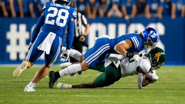 Baylor Bears wide receiver Hal Presley (16) catches a pass against Brigham Young Cougars linebacker Ben Bywater (2) in the first half at LaVell Edwards Stadium.